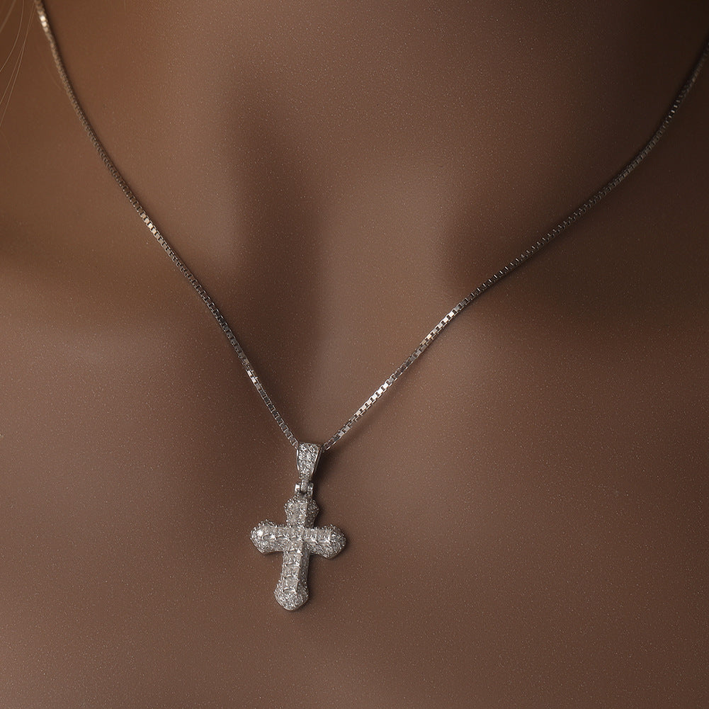 Gold-plated, diamond-encrusted mini cross necklace