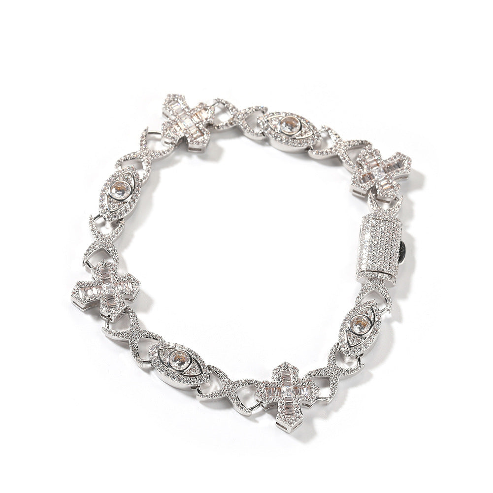 Silver bracelet with intricate designs on a white background
