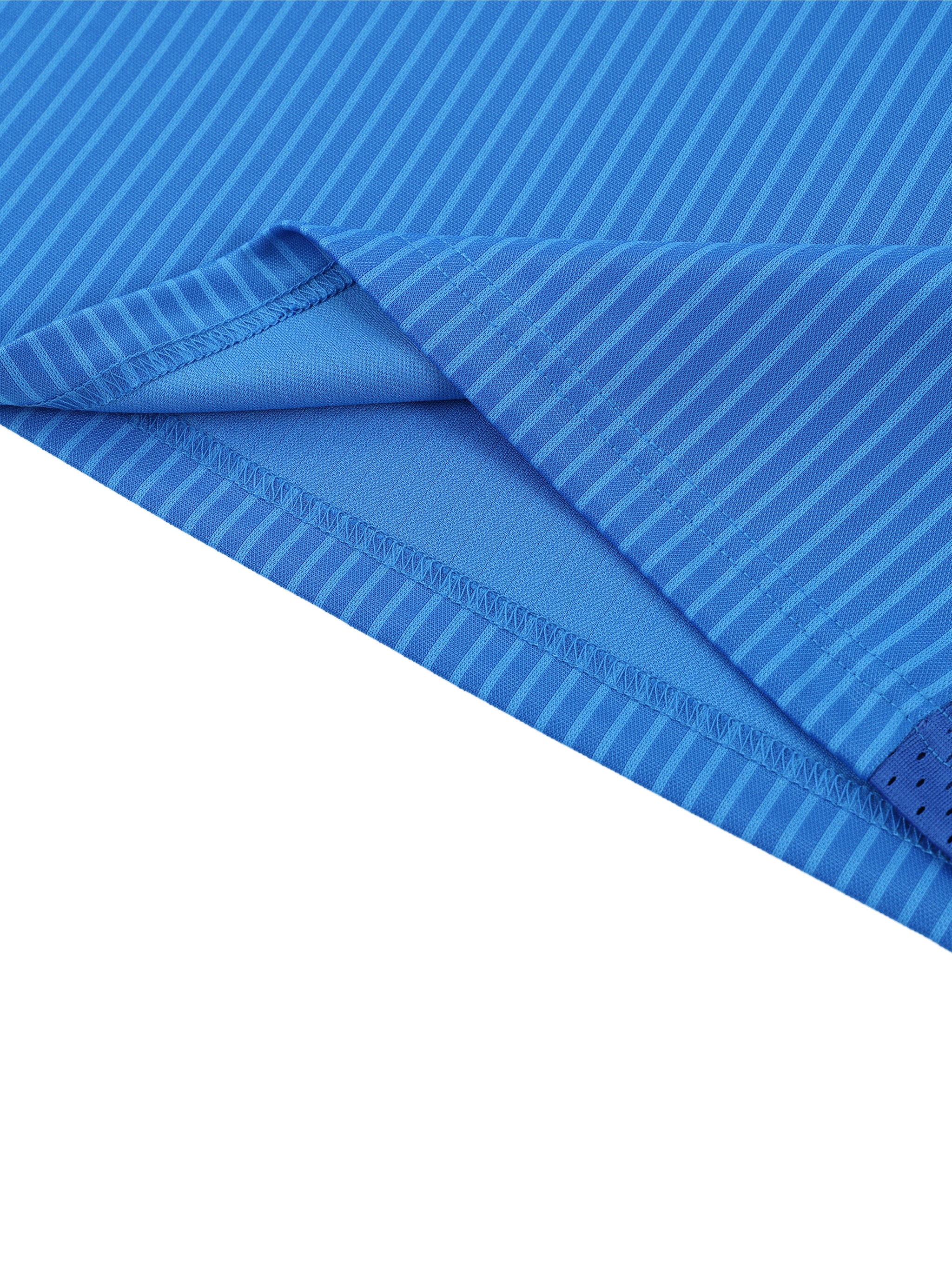 Close-up of blue fabric with a textured pattern on a white background
