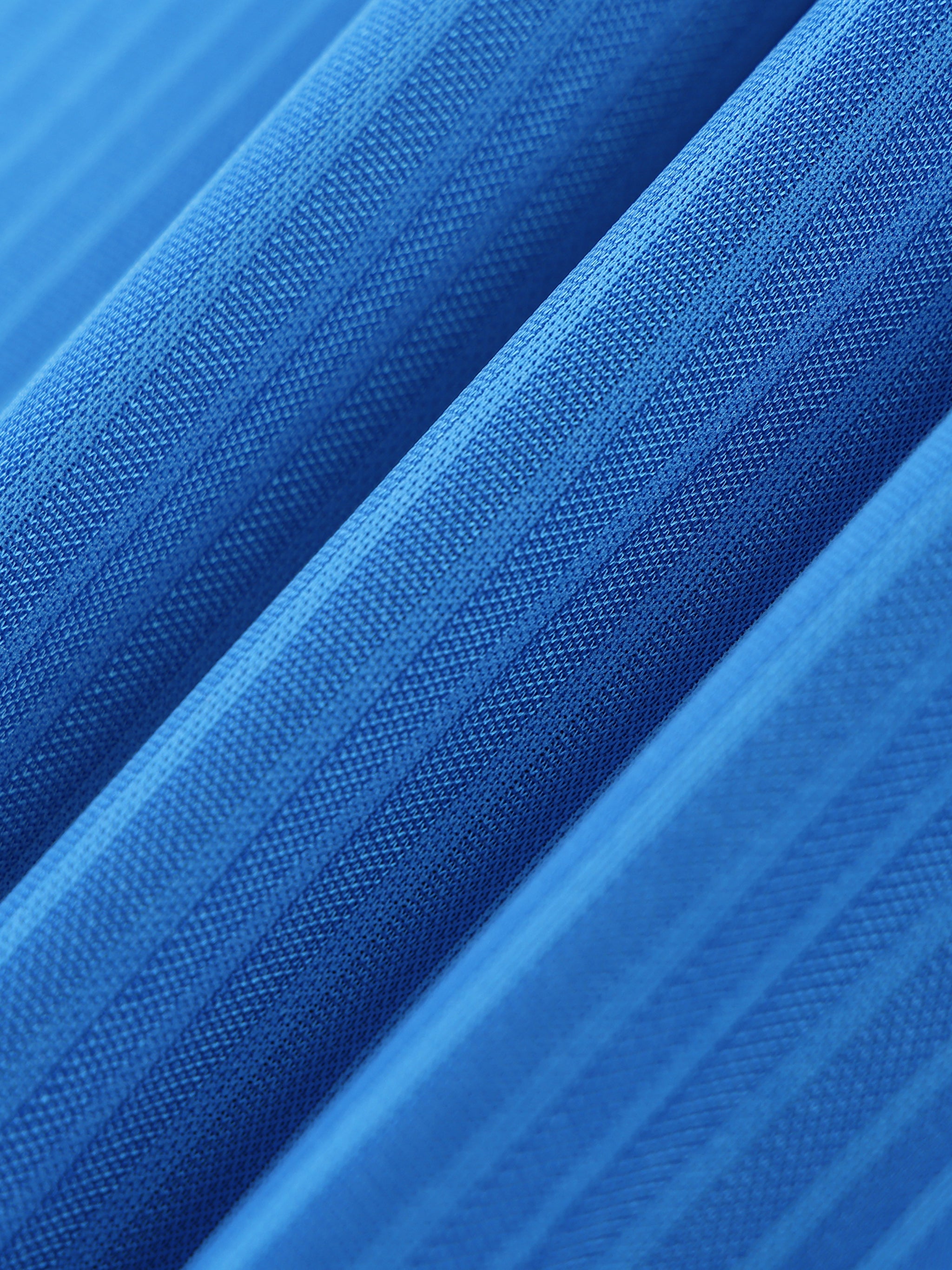 Close-up of blue fabric with a textured pattern